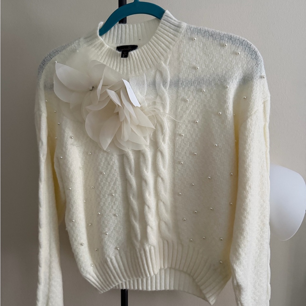 Elegant Cream Sweater with Floral Accent